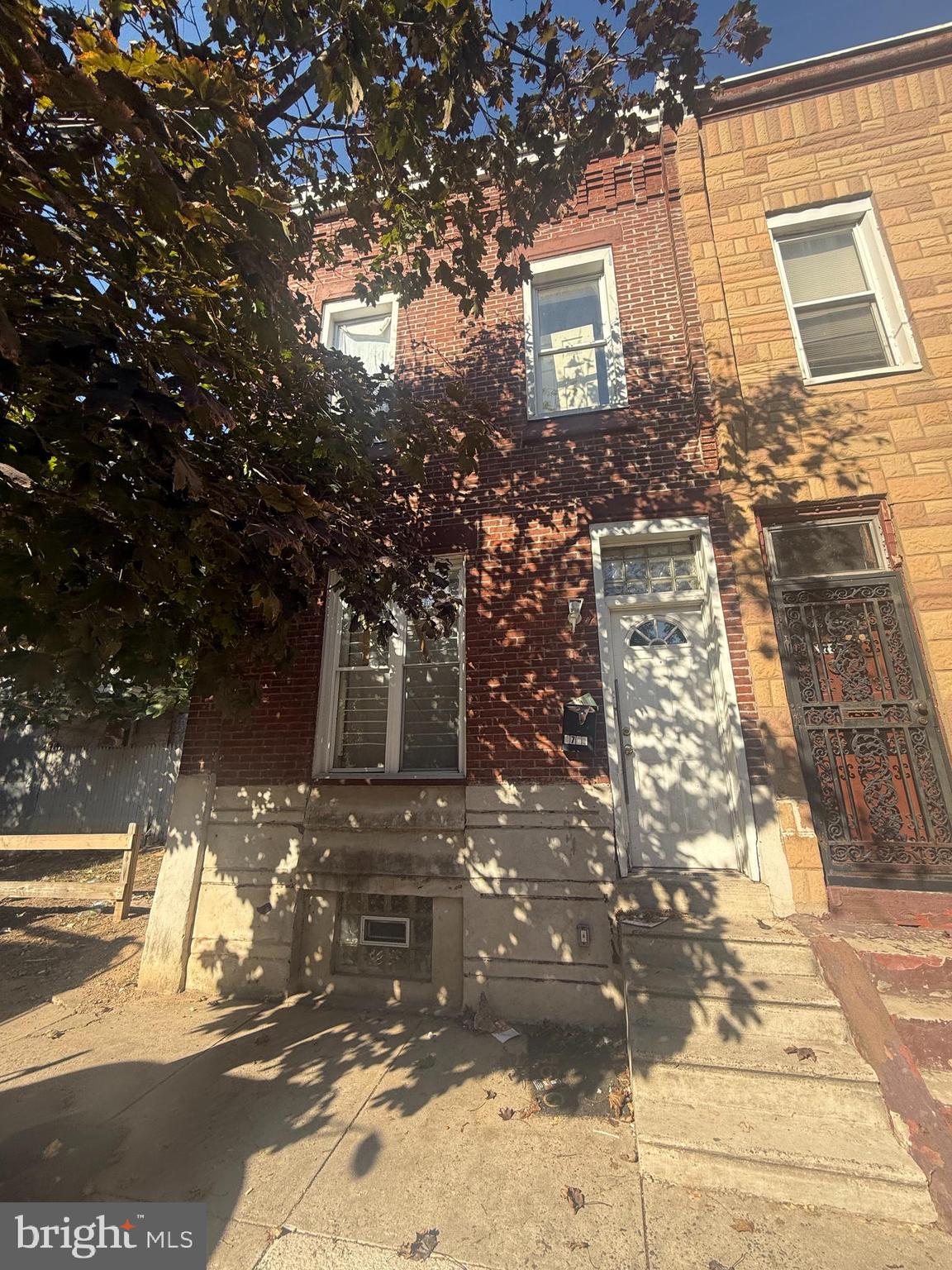 a view of a brick house with many windows