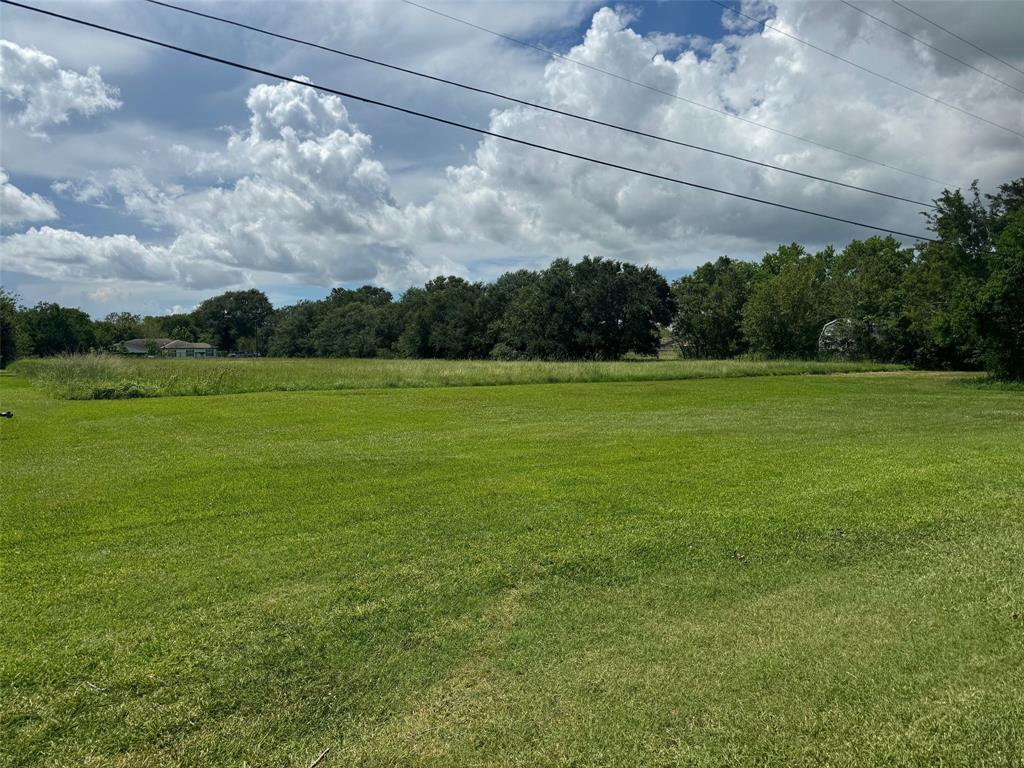 a view of a big yard with a house