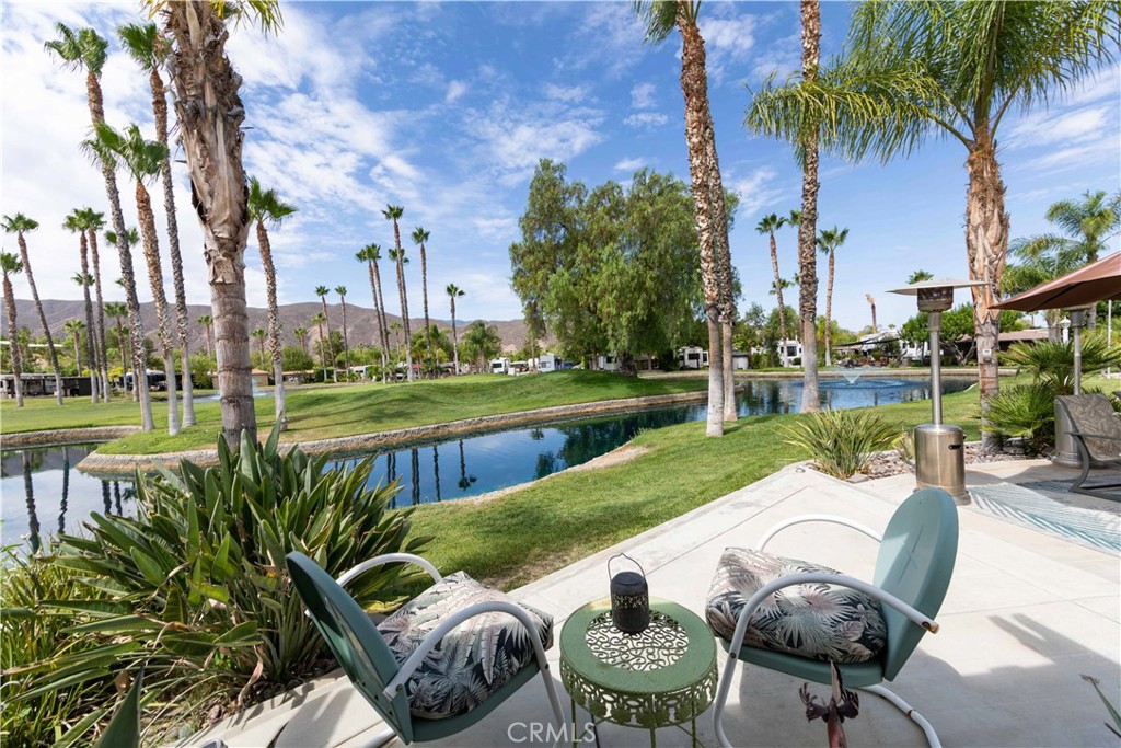 a view of a swimming pool and patio in the backyard