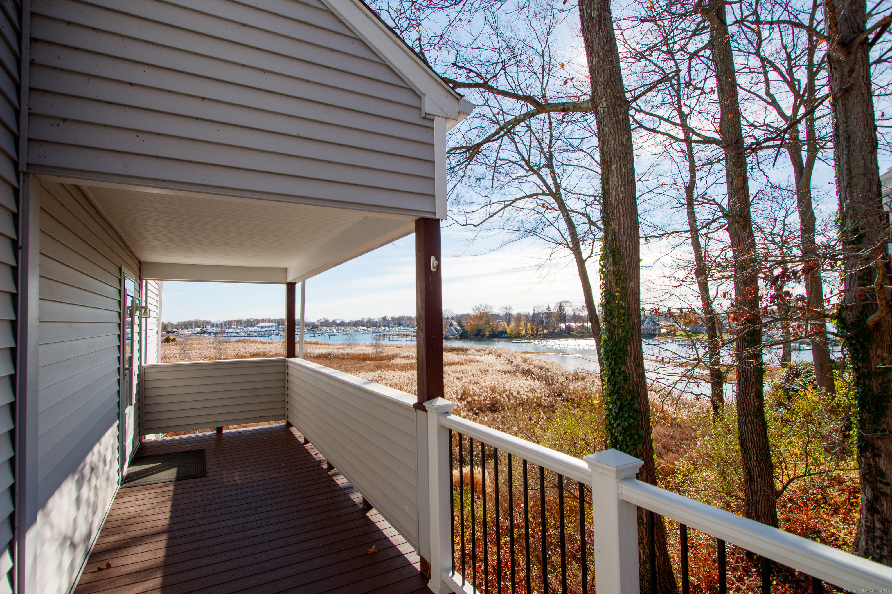 Walkway to 70 Quarry Dock Road at Sylvan Point, a waterfront community. This unit is directly facing the Branford River with views of salt marsh and marinas.