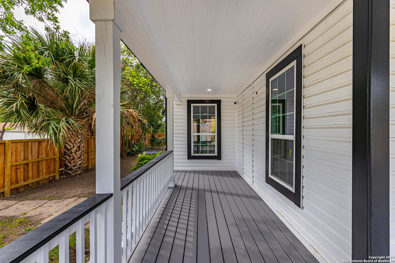 a view of a balcony with wooden floor