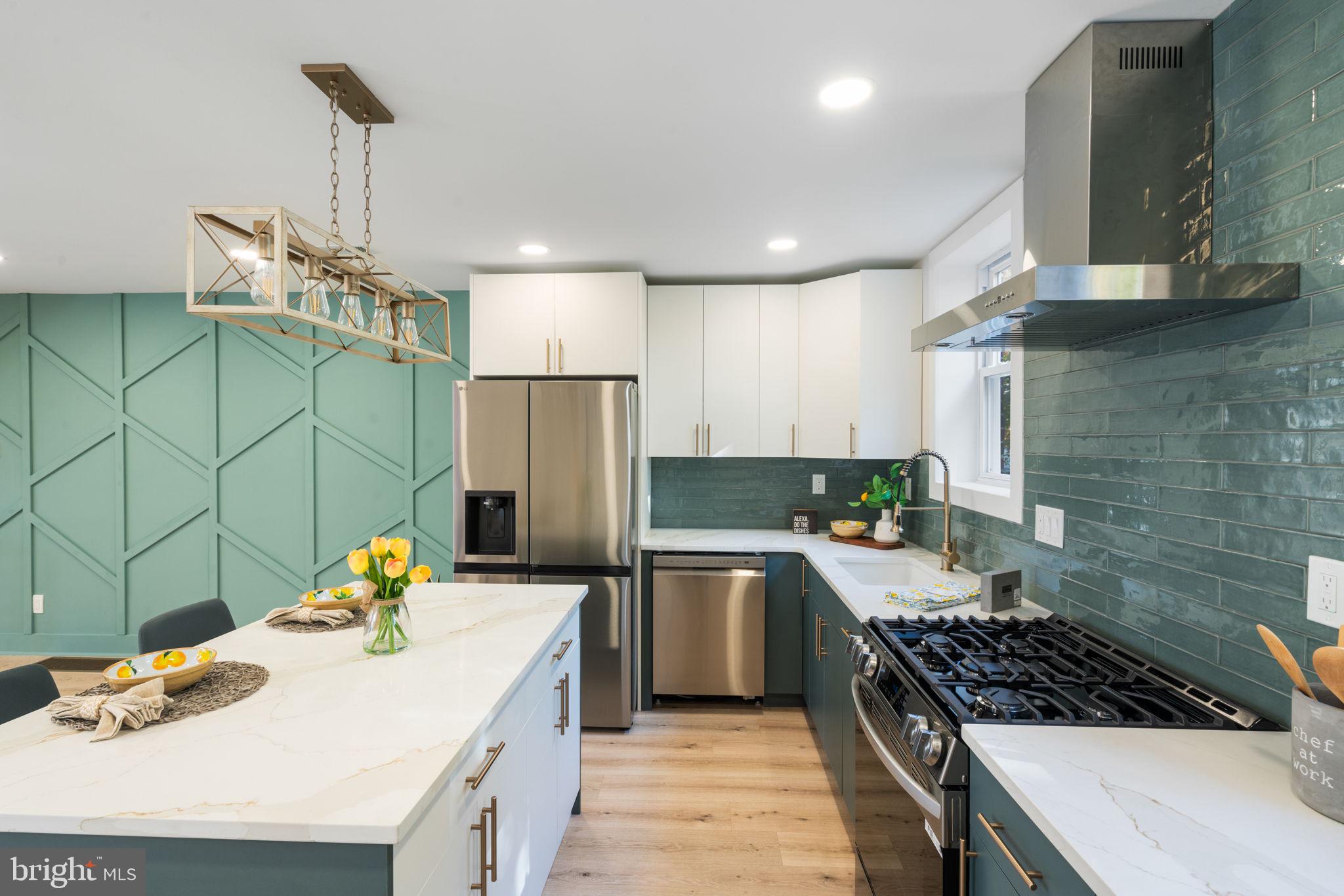 a kitchen with a sink appliances and cabinets