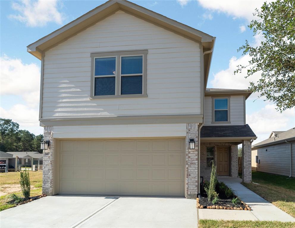 Welcome home to 2607 Bluewood Court located in Grace Landing and zoned to Willis ISD!