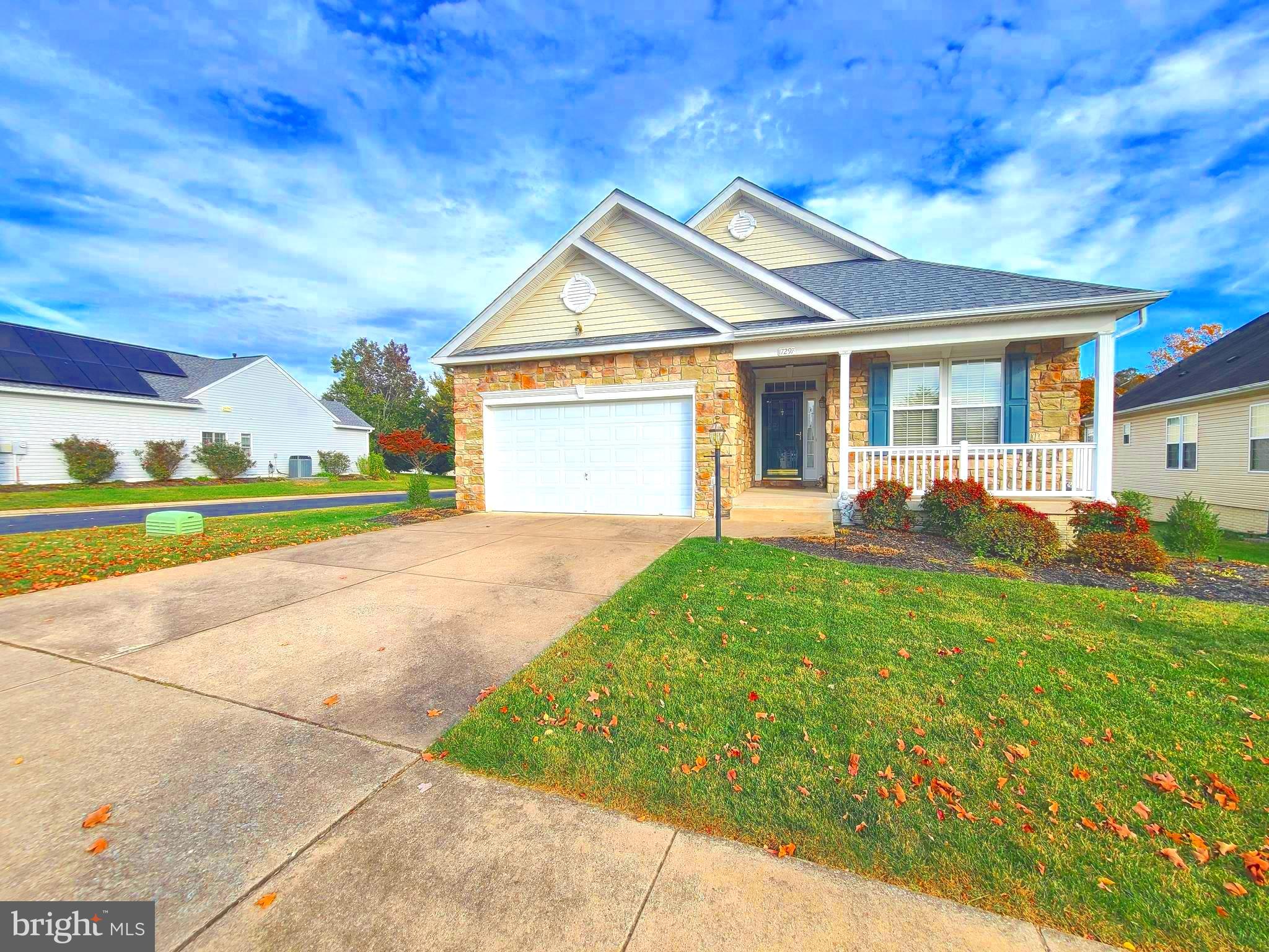 a view of a house with yard and tree s