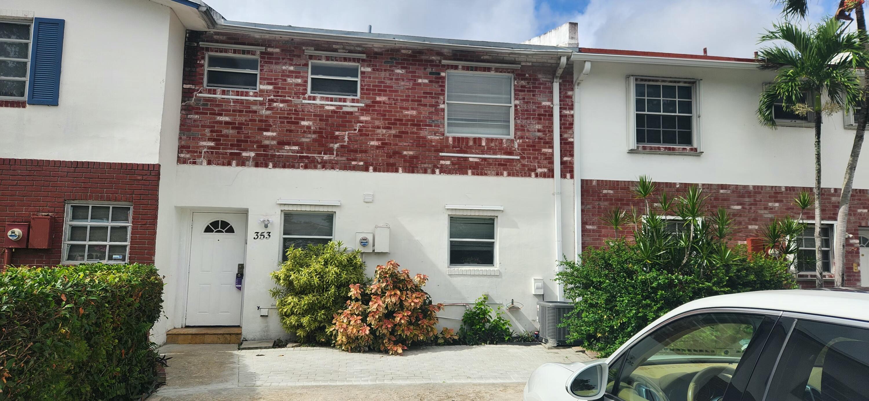 a front view of a house with yard