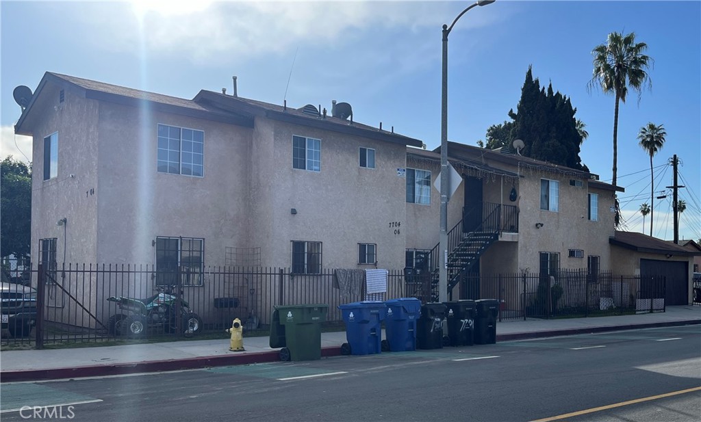 a view of a street in front of a house