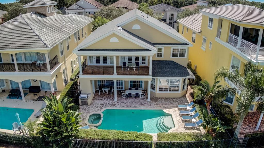 an aerial view of a house with swimming pool