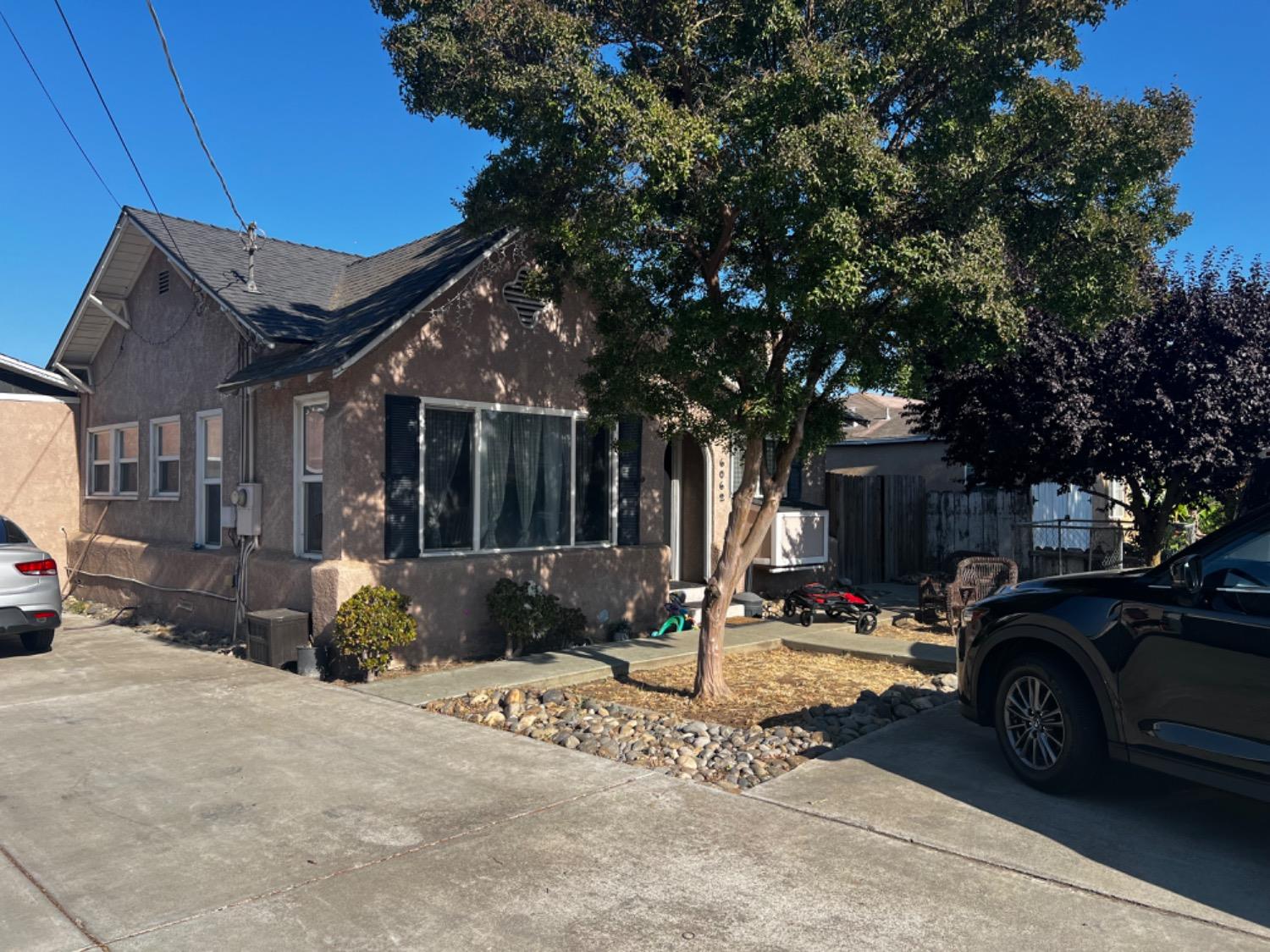 a view of a parked cars in front of a house