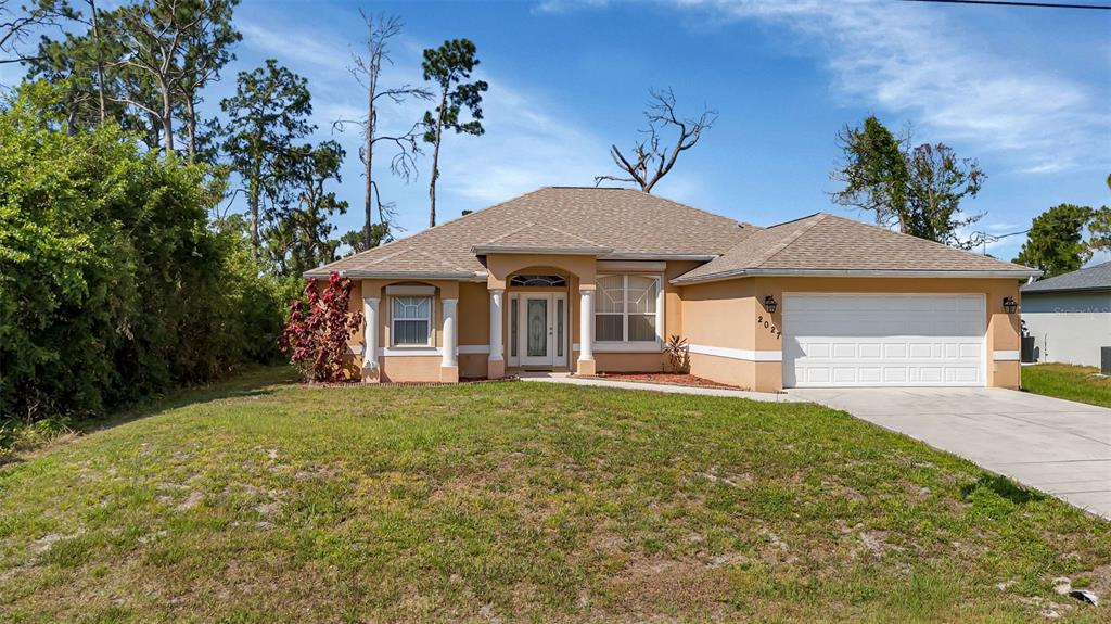 a front view of a house with a yard