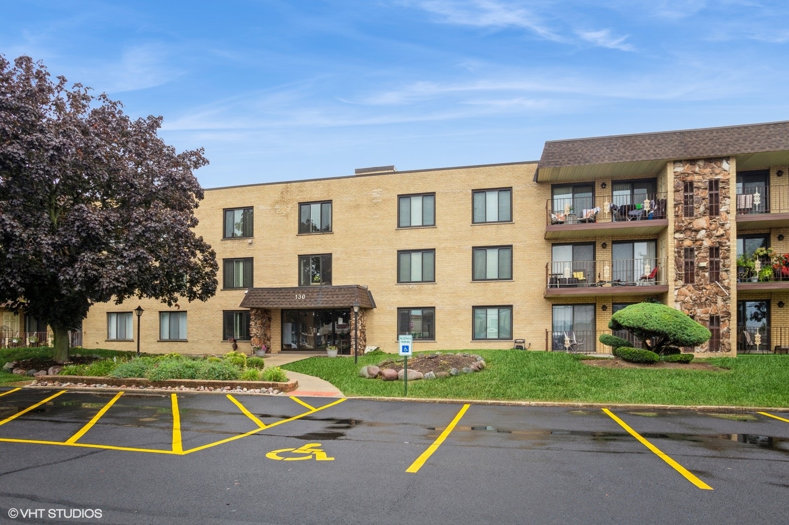 a front view of building with yard