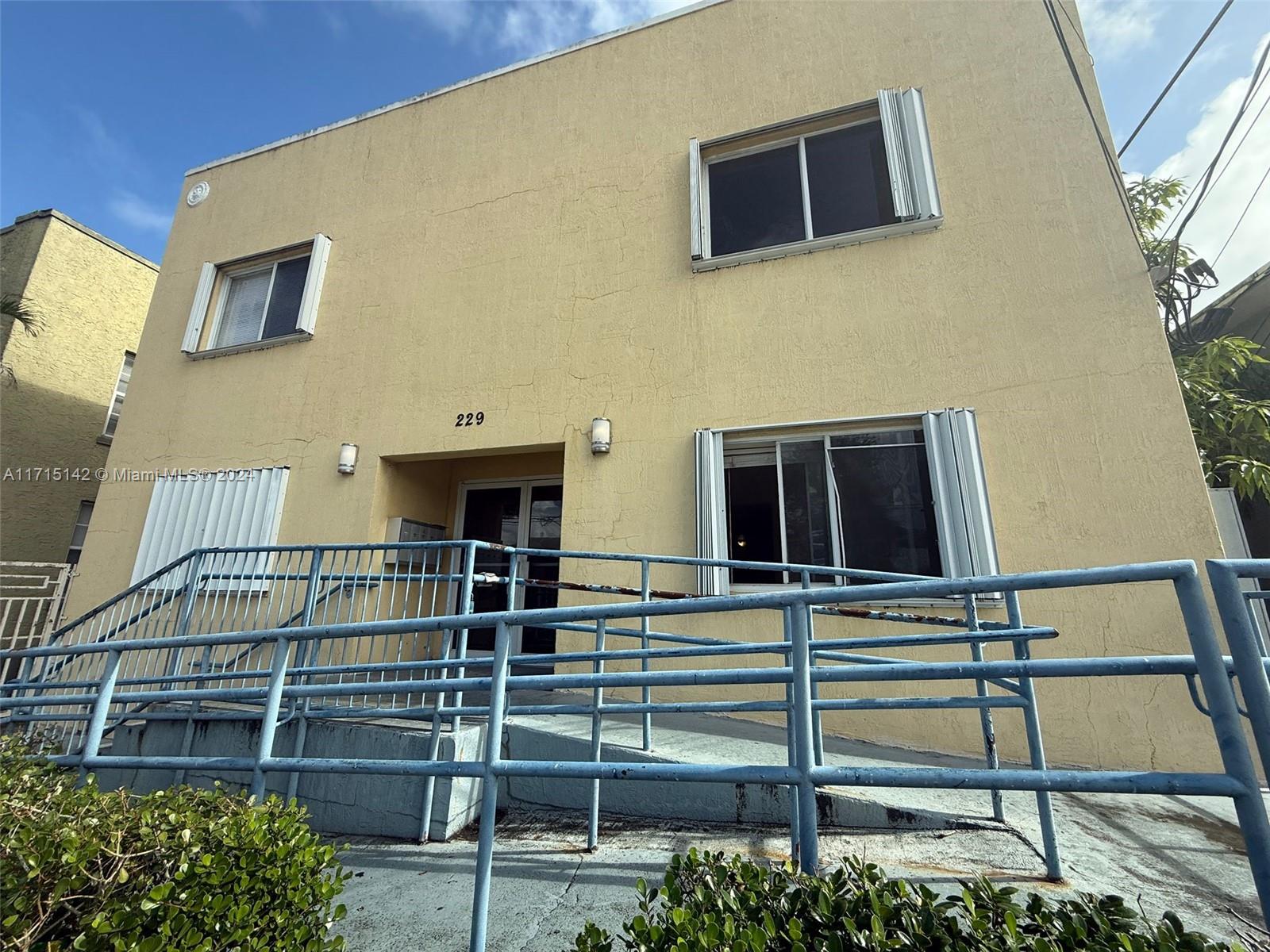 a front view of a house with stairs