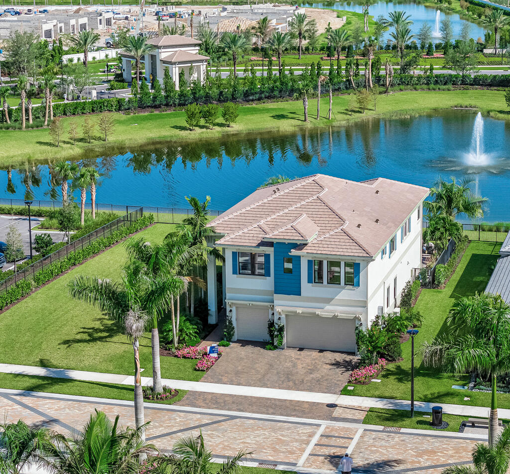 an aerial view of a house with a yard and a garden