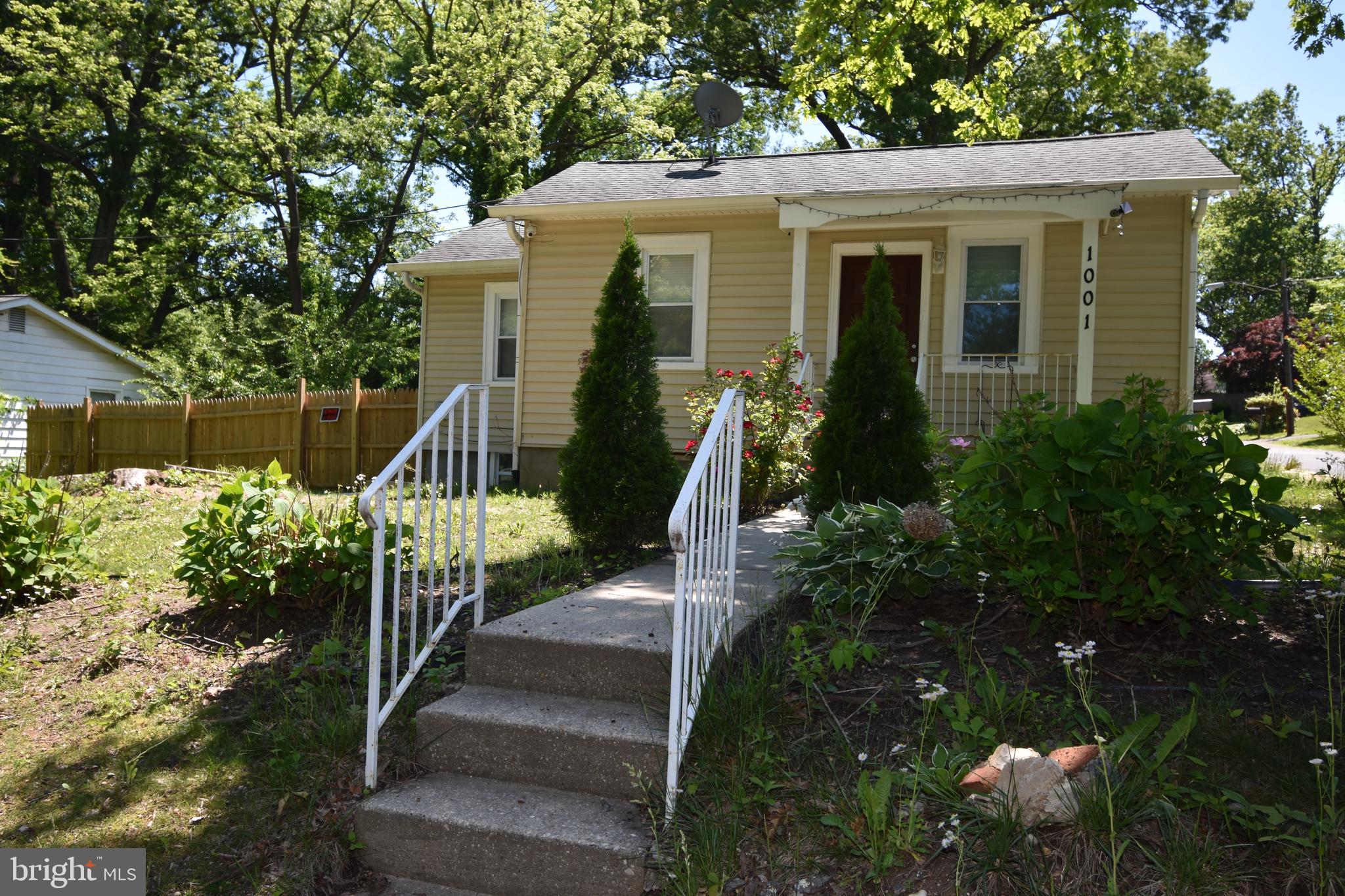 a front view of a house with a yard in front