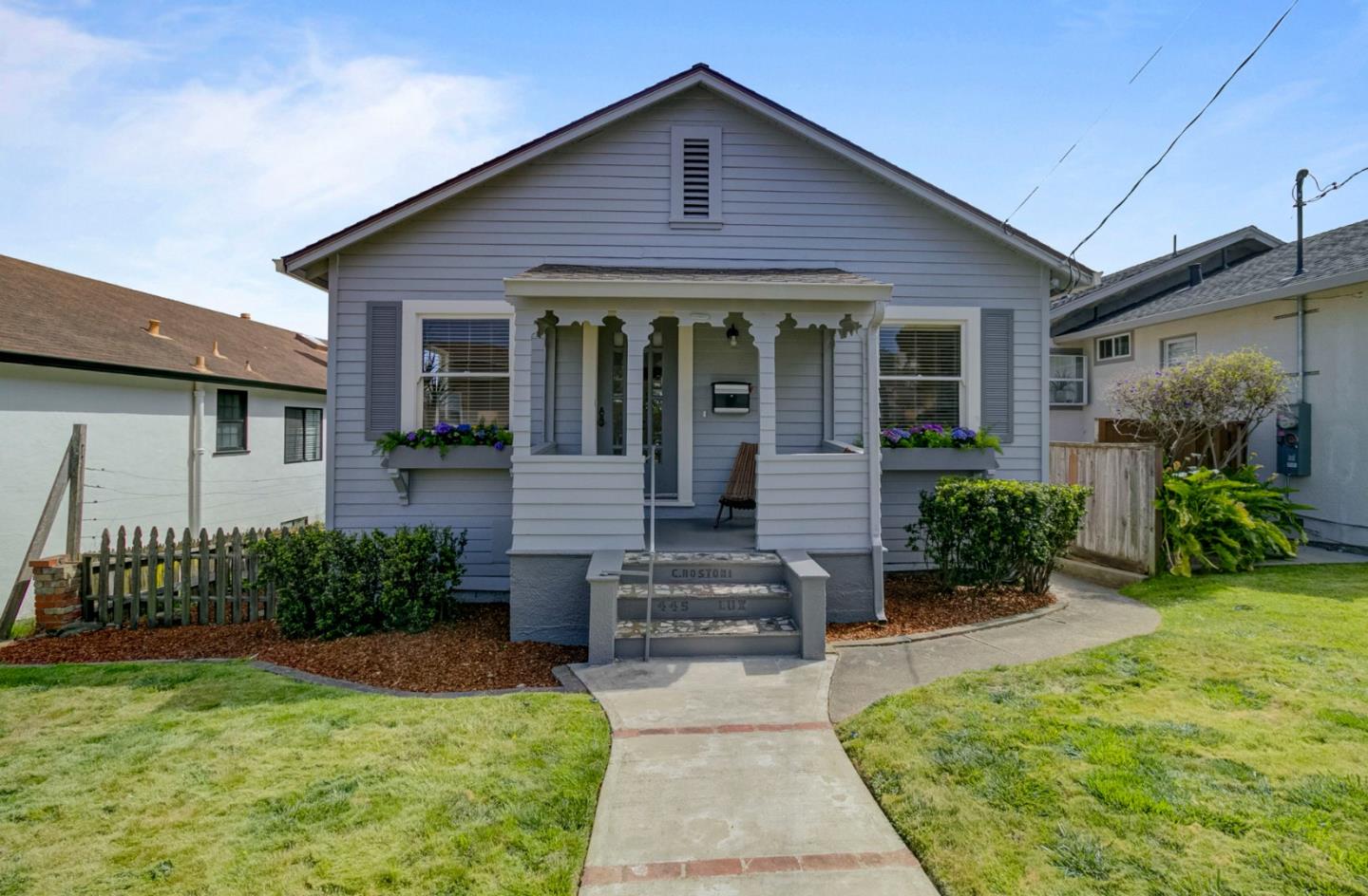 a front view of a house with garden