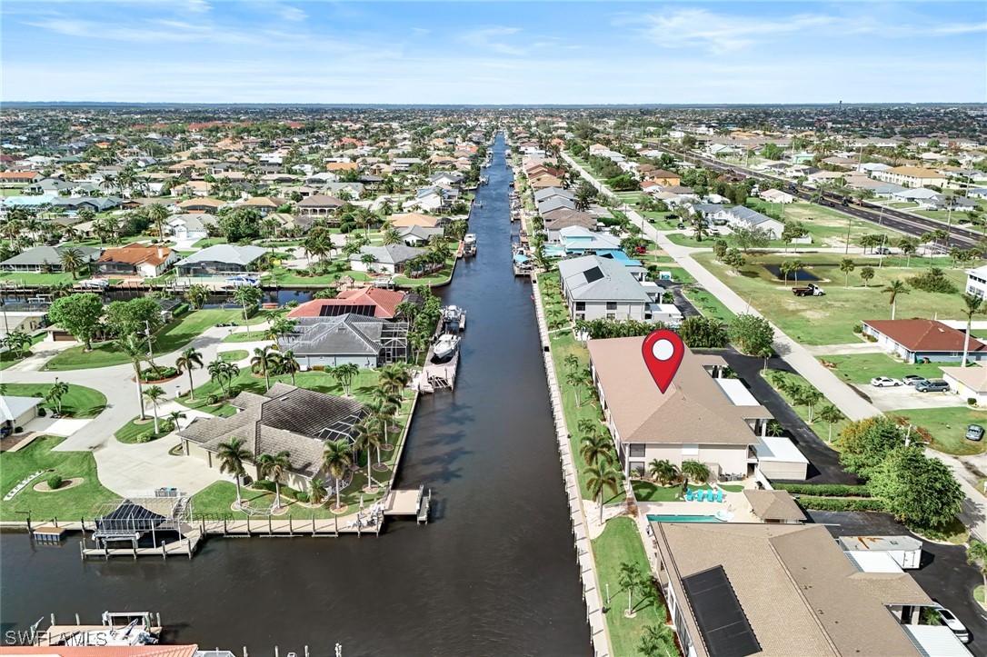 an aerial view of residential building and ocean view