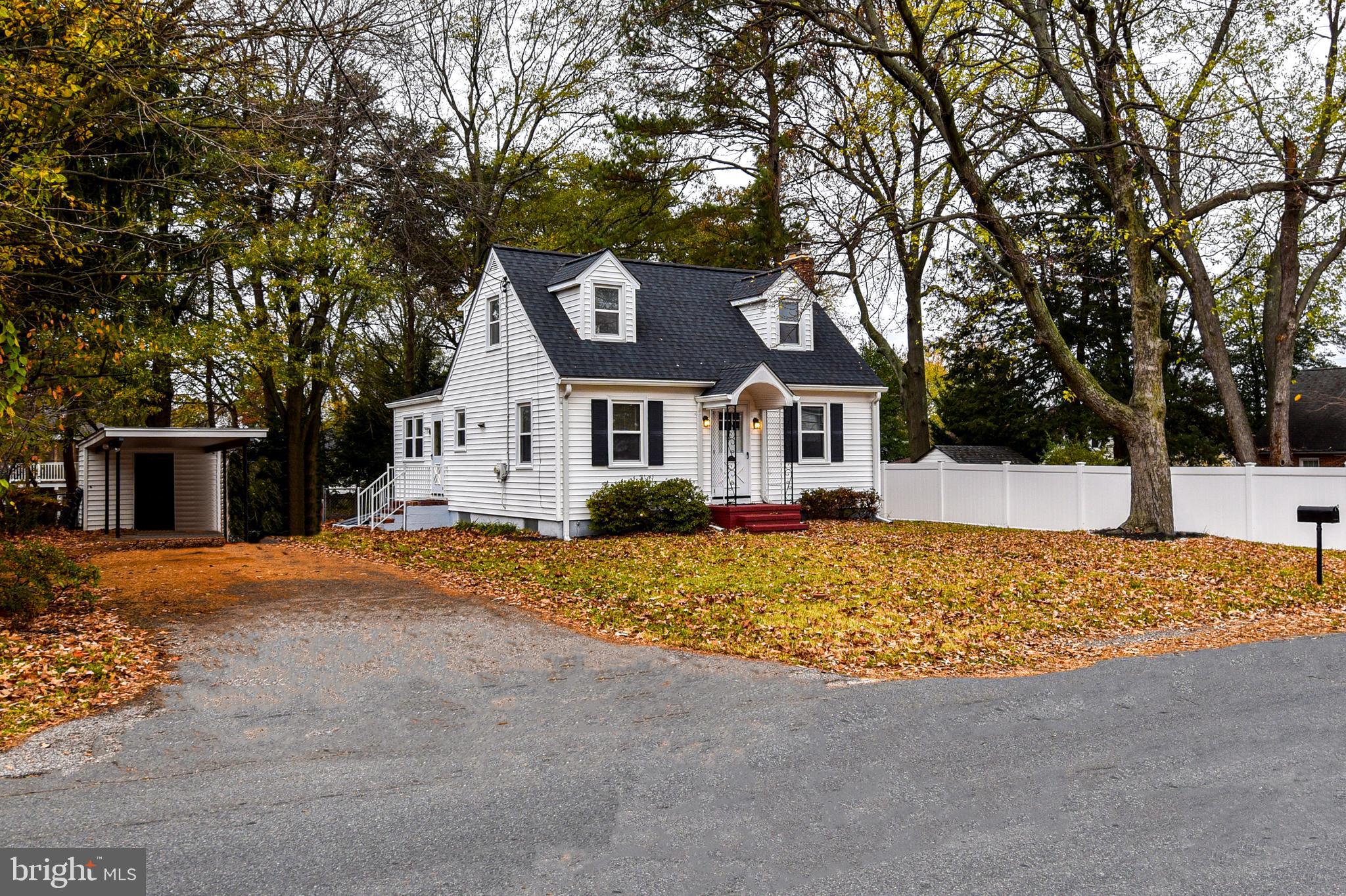 a view of a house with snow on the background