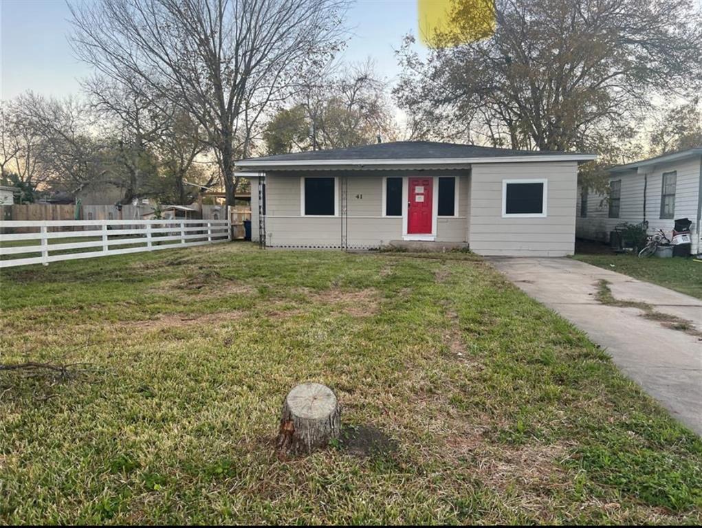 a view of a house with a backyard