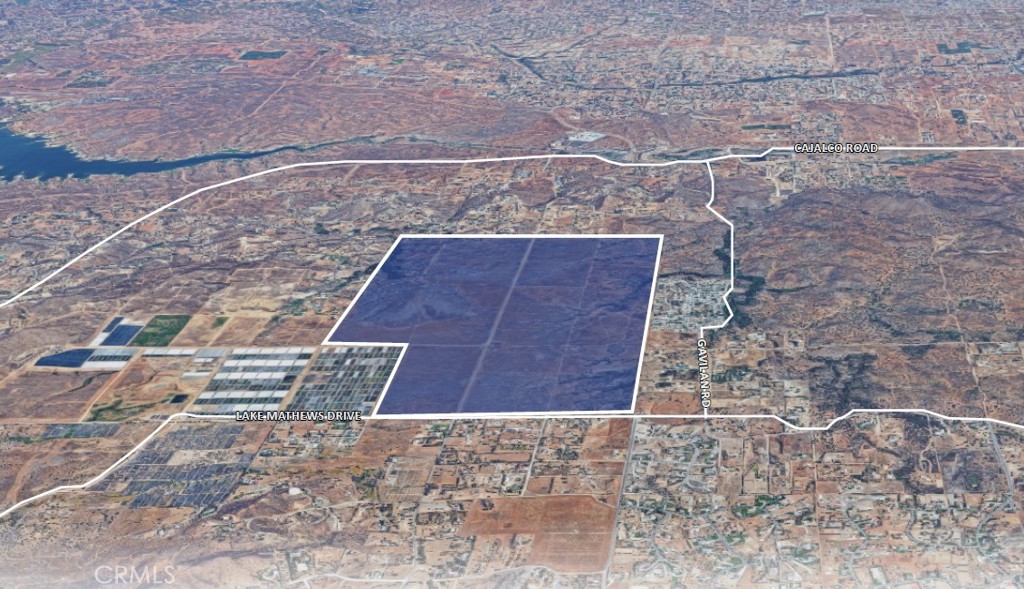 a aerial view of a brick house with a yard