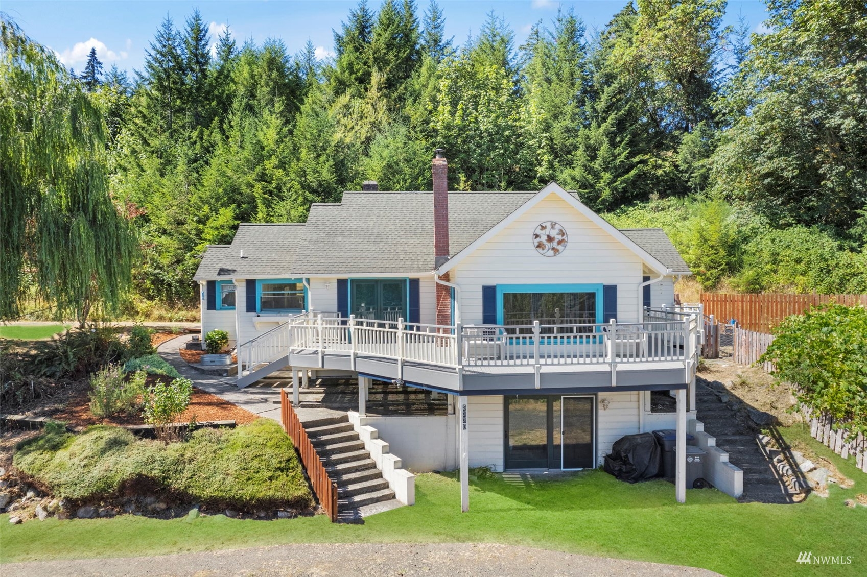 a front view of house with yard and green space