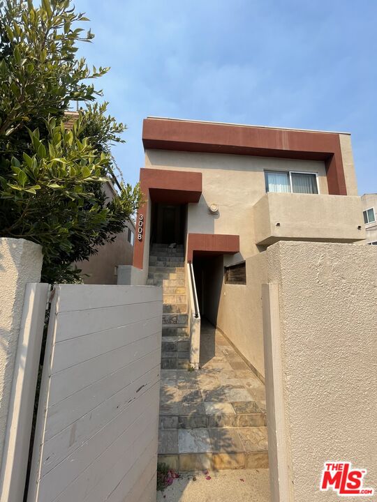 a backyard of a house with seating space