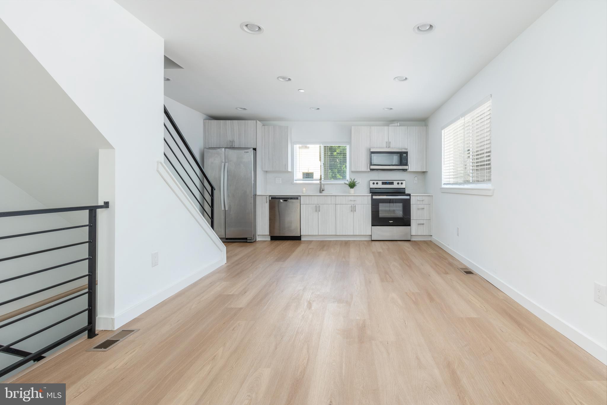 a open kitchen with a white cabinets and stainless steel appliances