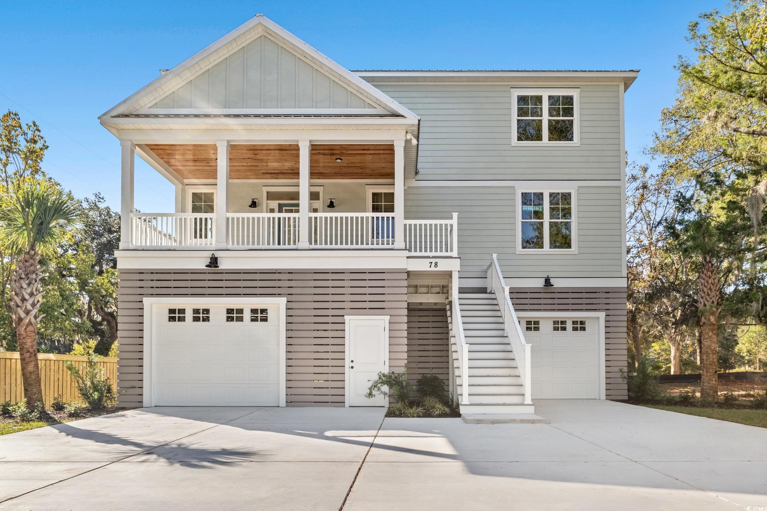 View of front facade featuring a garage