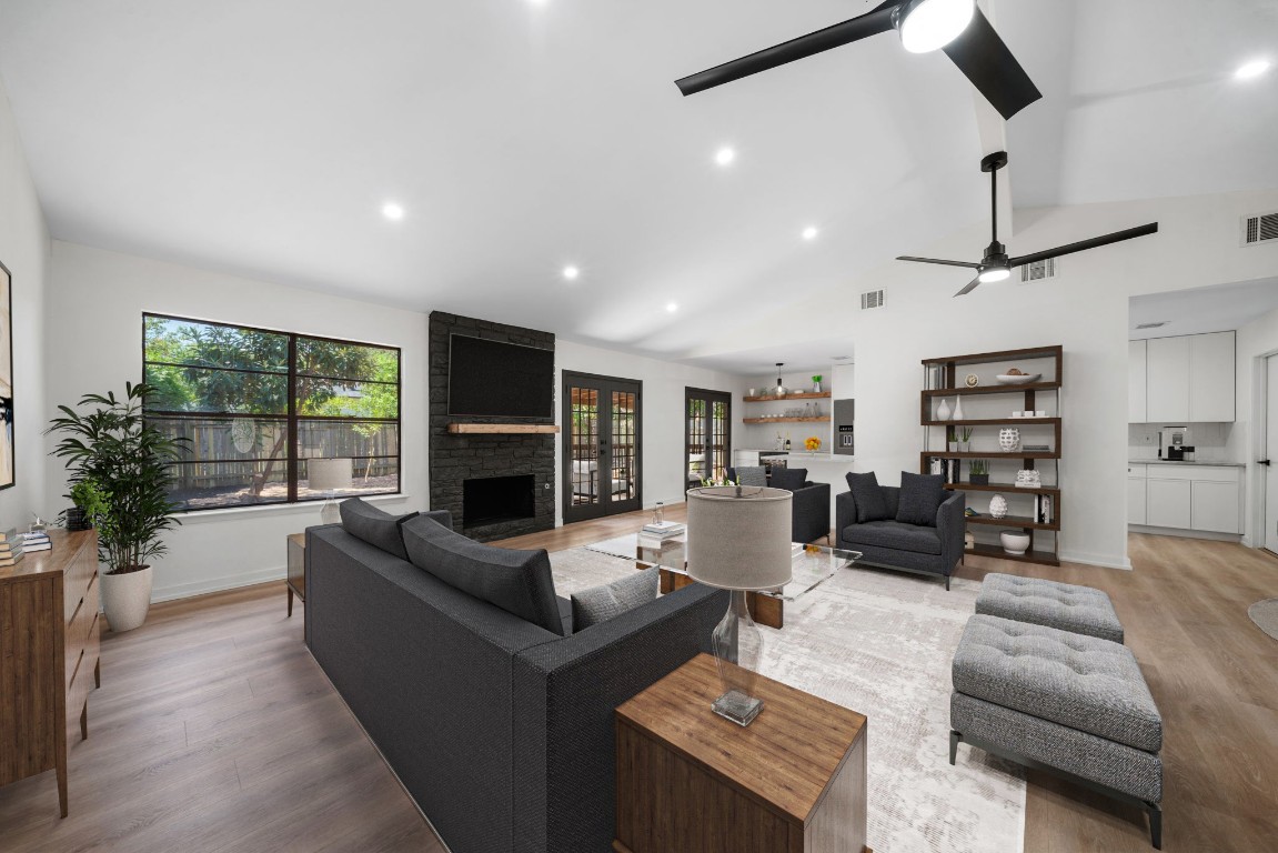 a living room with furniture fireplace and flat screen tv