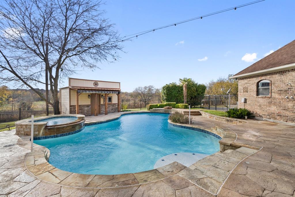 a view of a swimming pool with lounge chair