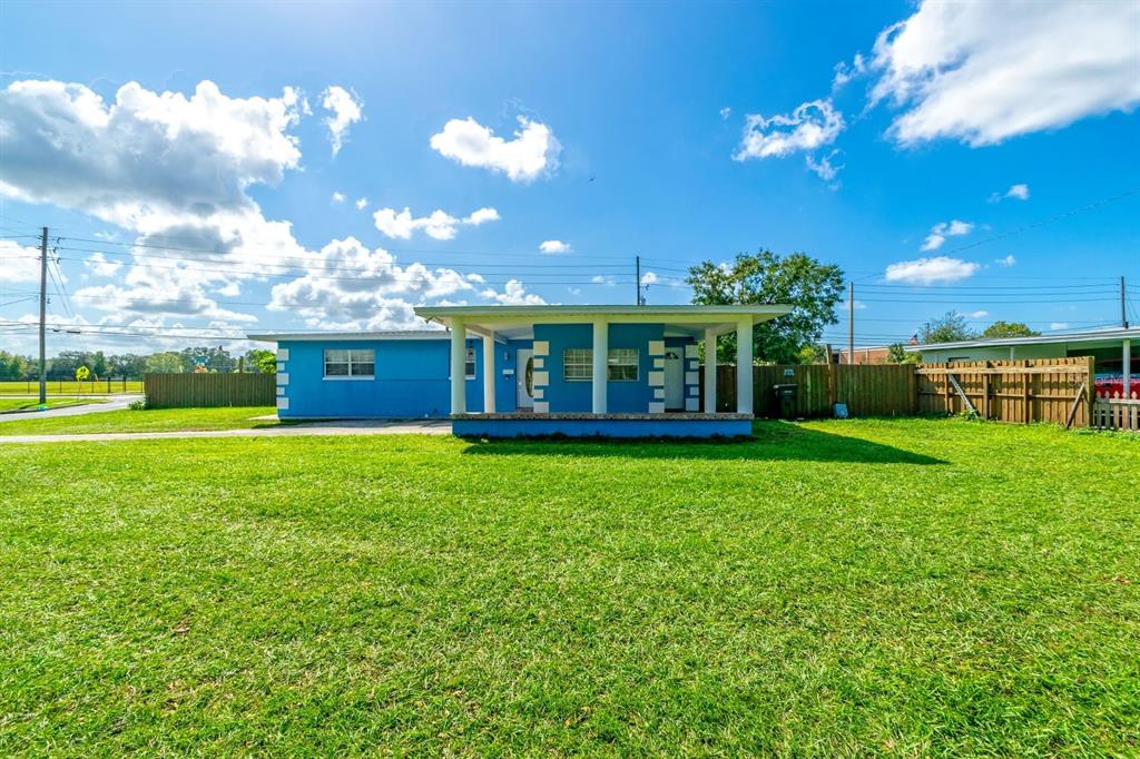 a view of a house with a big yard