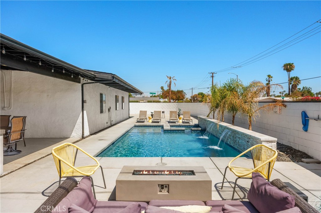 a view of a swimming pool with a patio