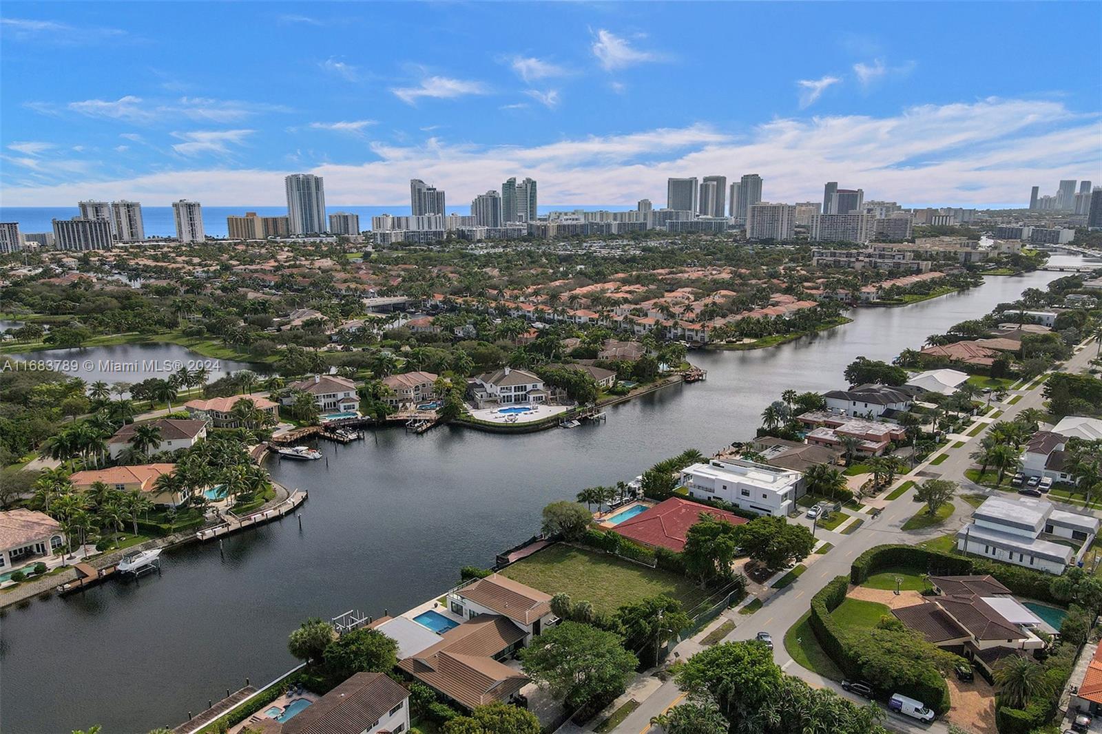 an aerial view of a city with lake view