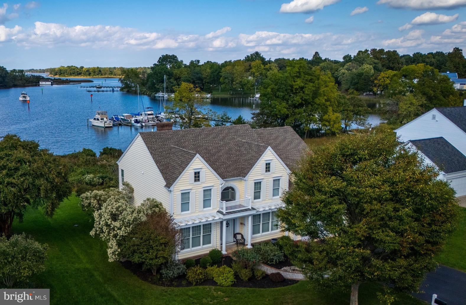 an aerial view of house with yard