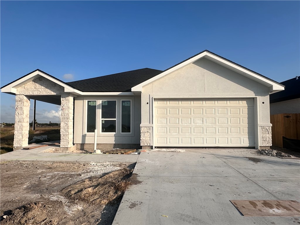 a front view of a house with a garage