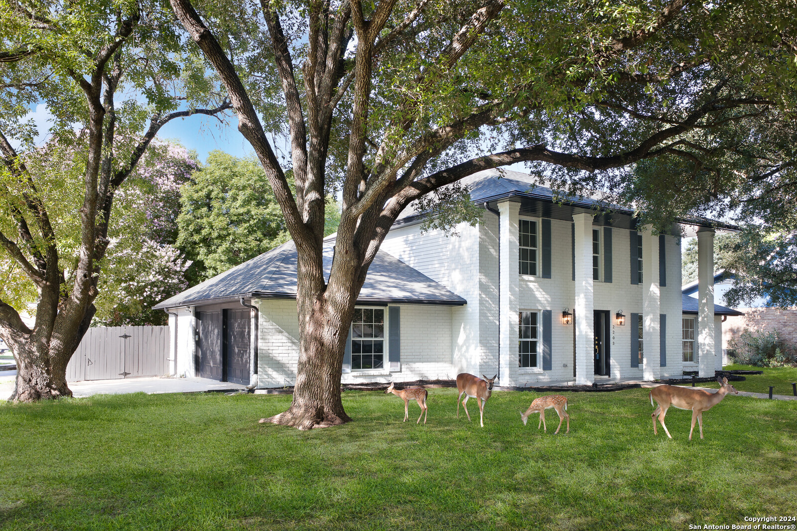 front view of a house with a yard