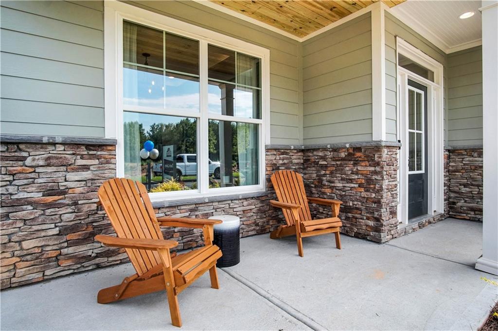 a view of a patio with a table and chairs