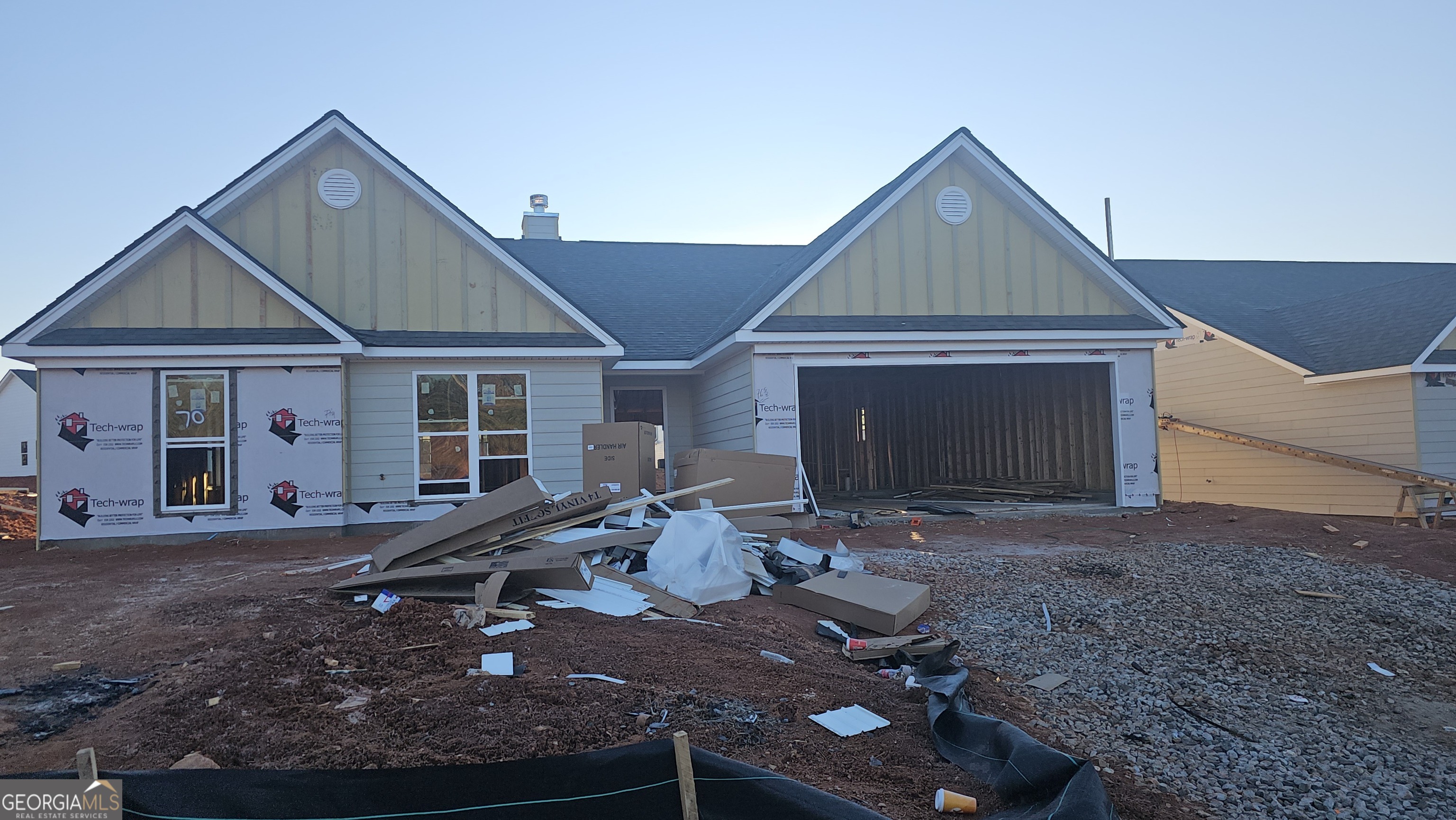 a front view of a house with sitting area