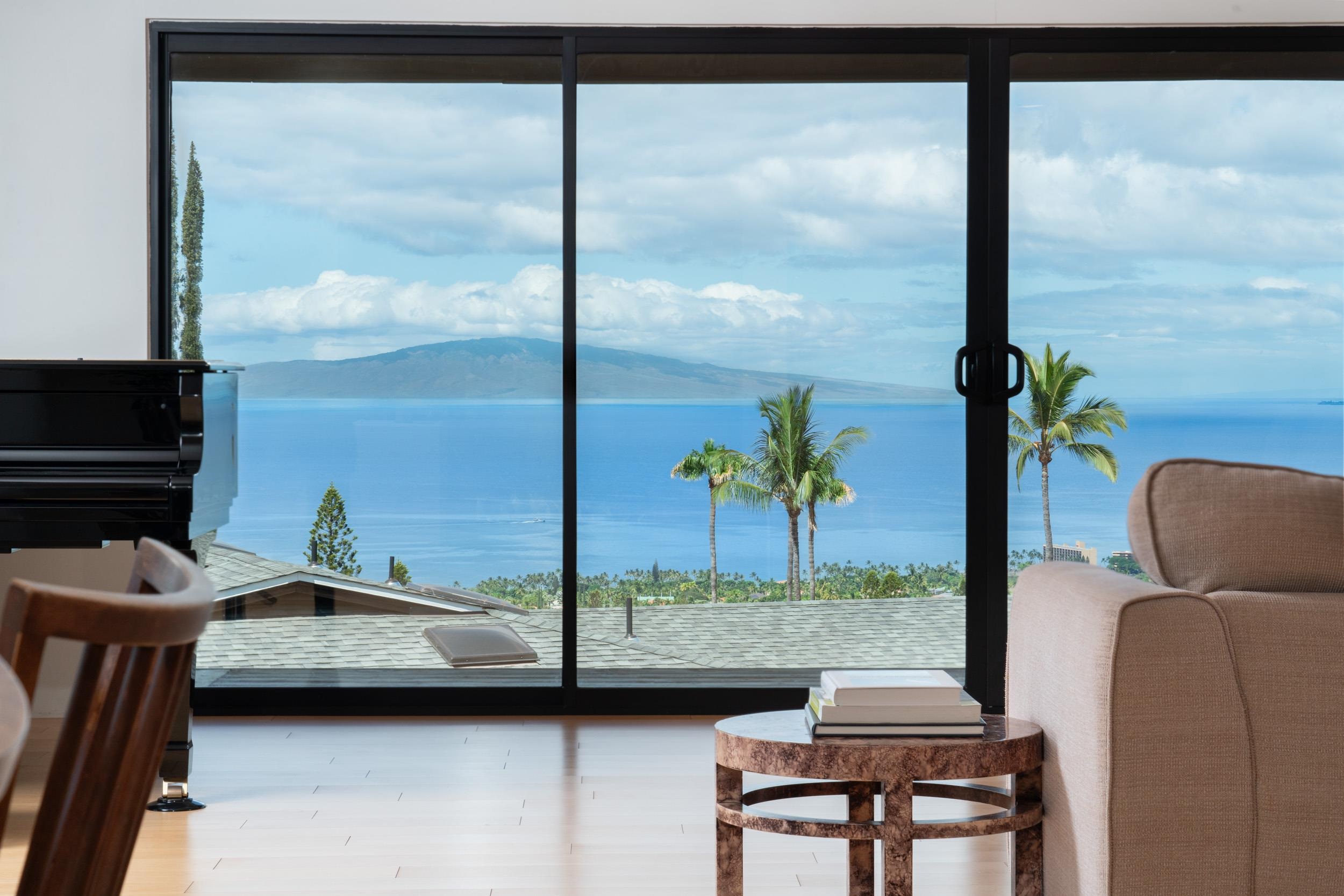 a view of living room with balcony and furniture