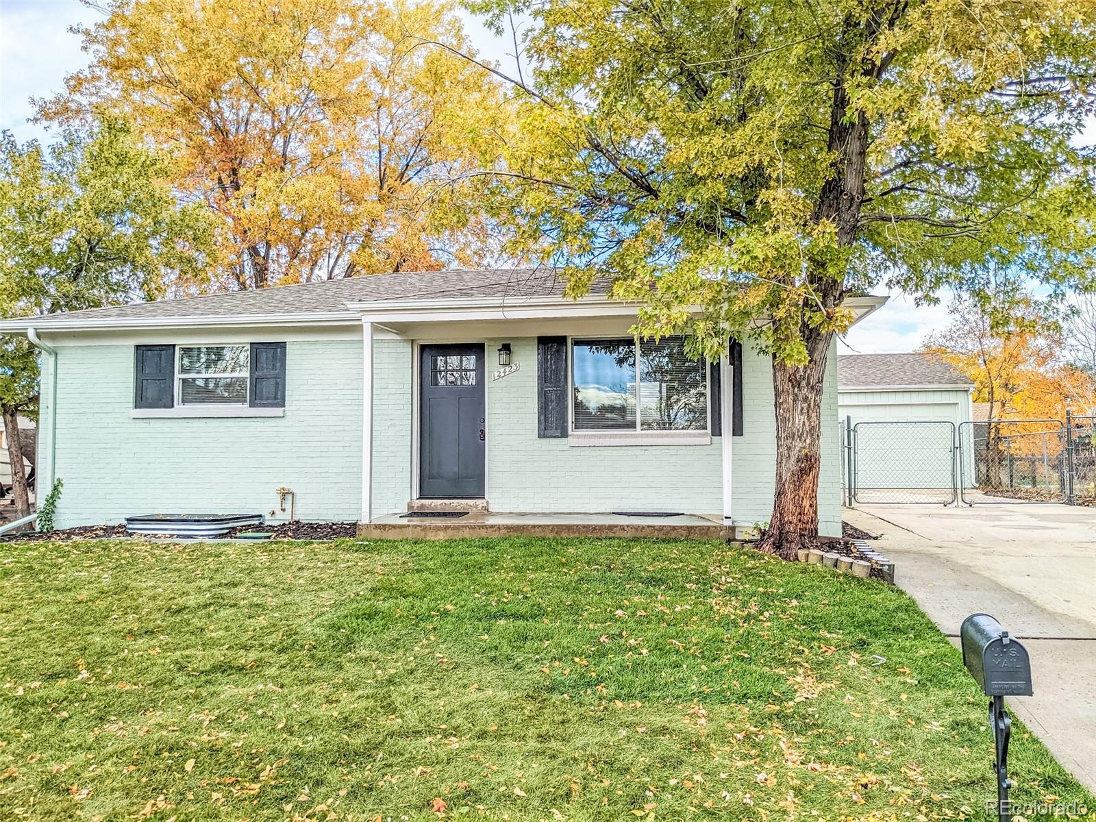 a front view of a house with yard