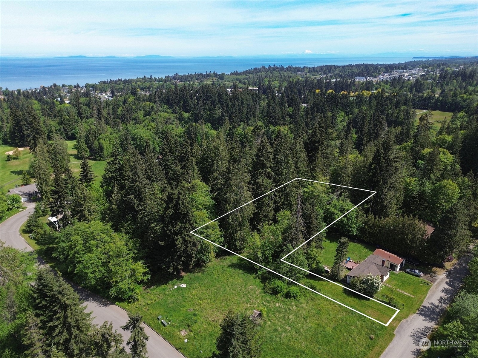 an aerial view of a house with a garden