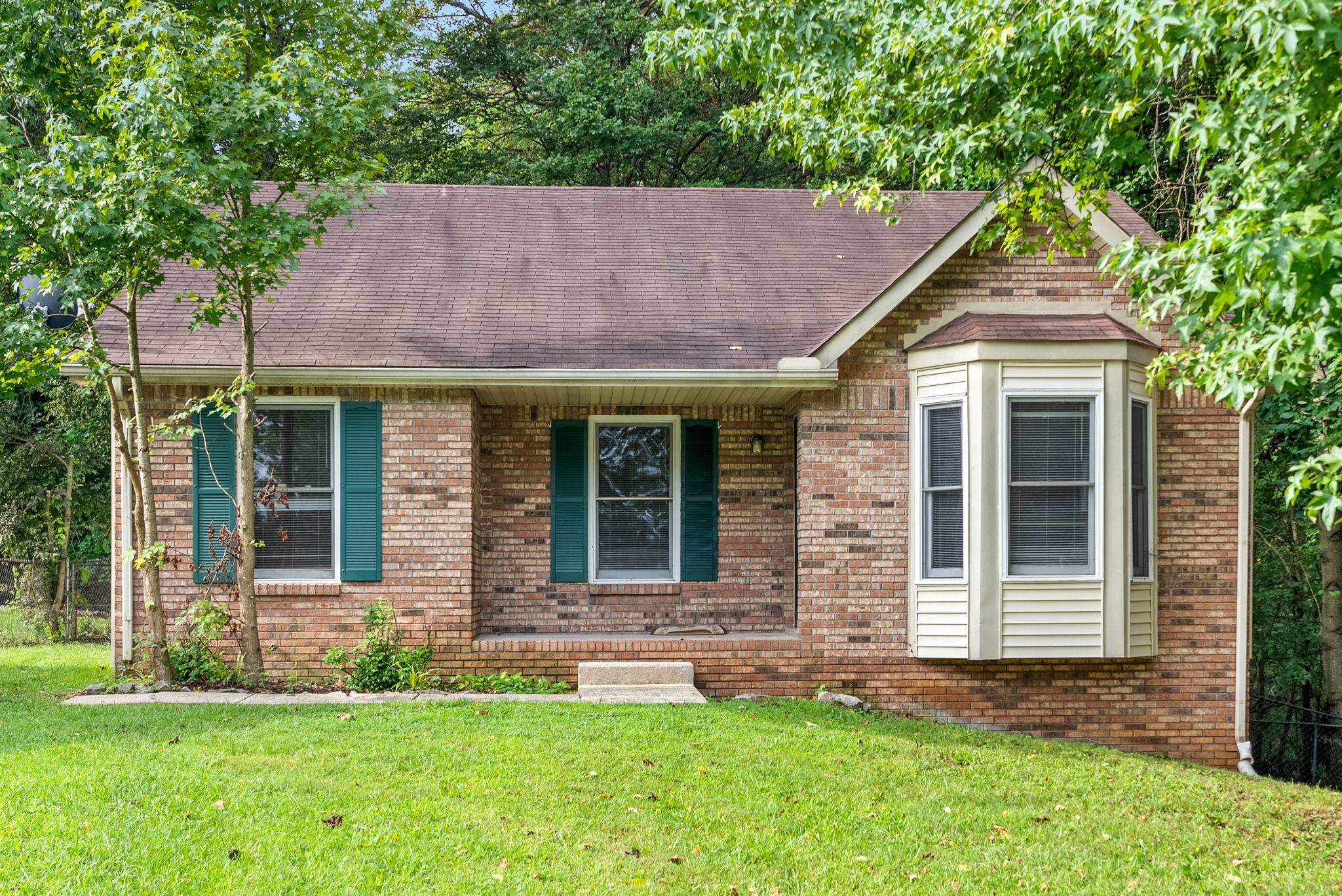 front view of a house with a yard