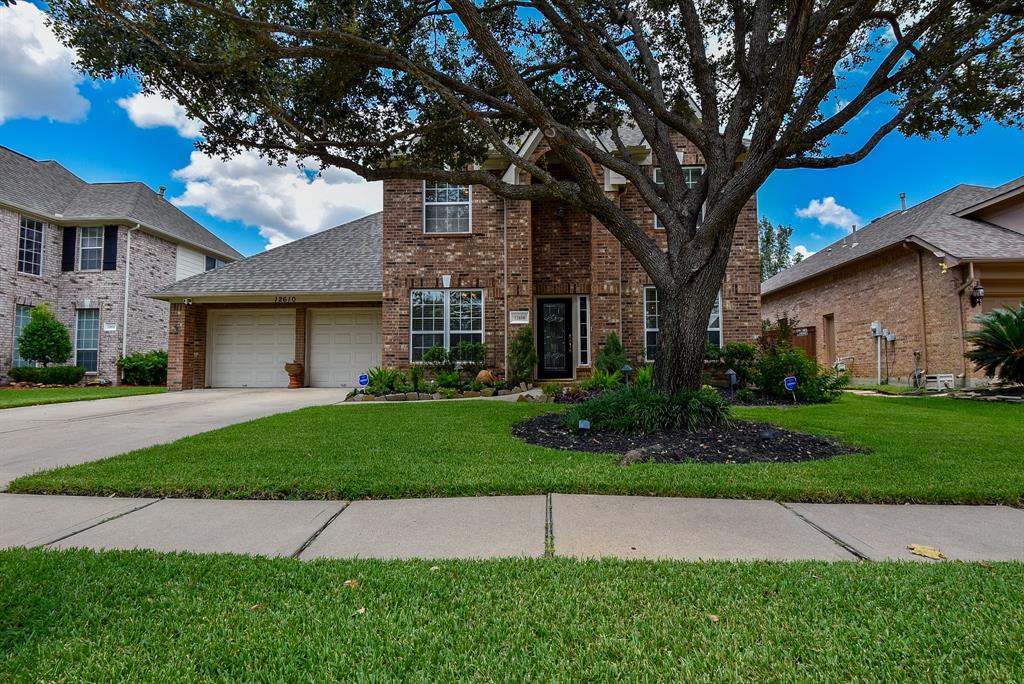 It's easy to fall in love with this pristine, single family, 2-story brick treasure at 12610 Tallwood Crossing Lane, Houston, in the Villages/Lakepoint community.