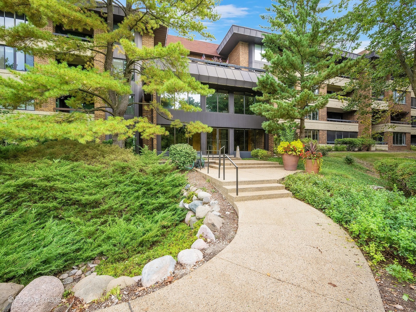 a front view of a multi story residential apartment buildings