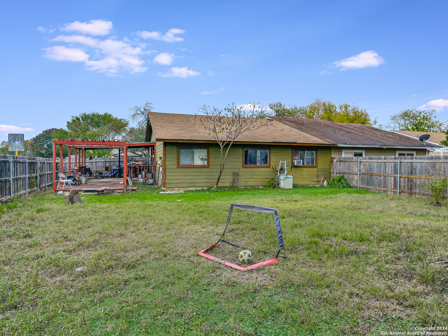 a front view of a house with a yard table and chairs