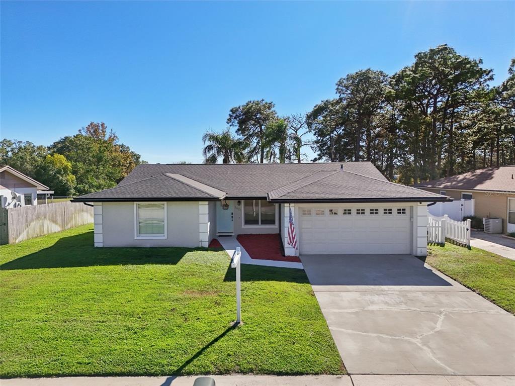 a view of a house with a yard