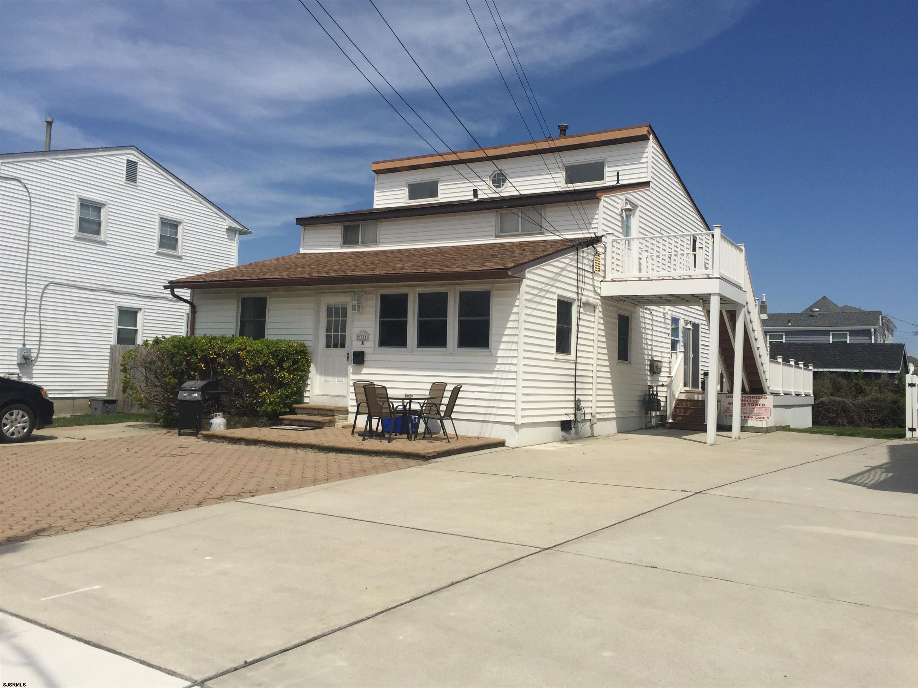 a front view of a house with patio