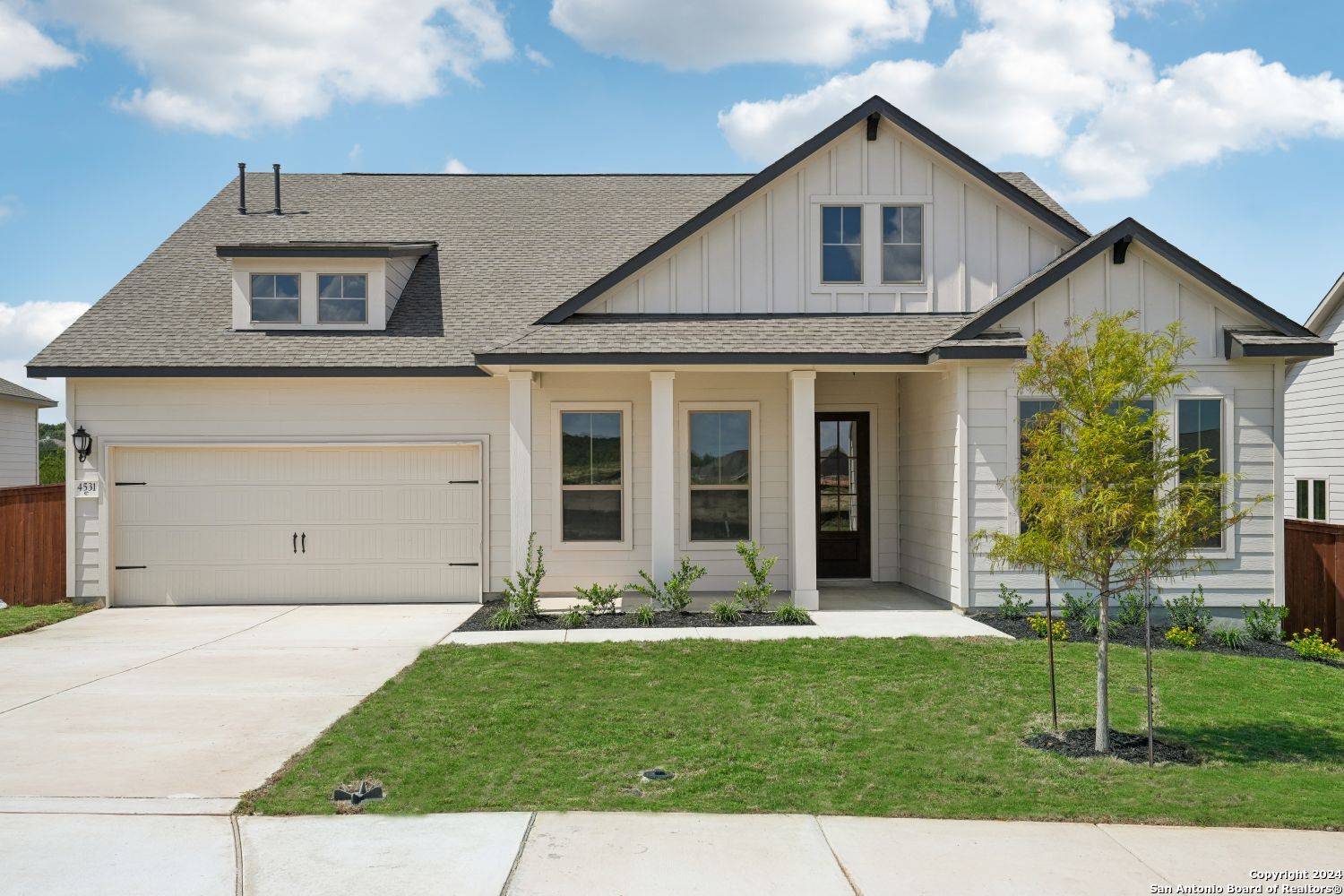 a front view of a house with a yard