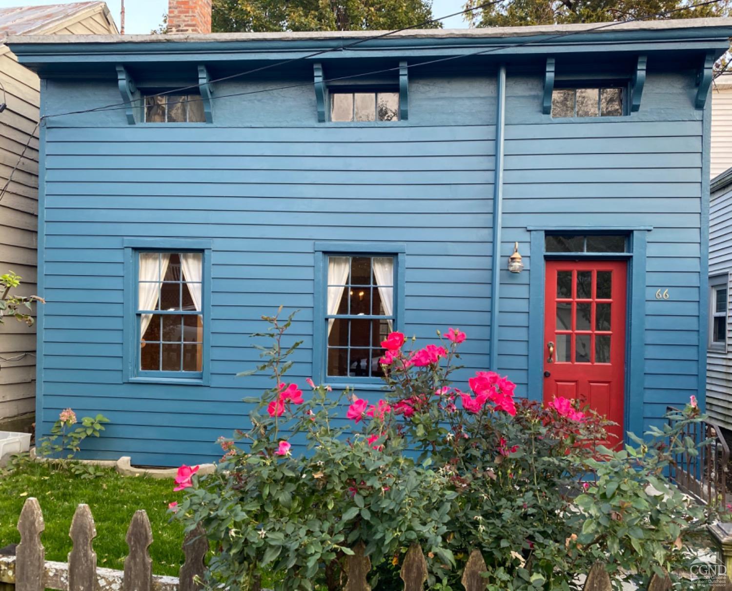 a small yard is sitting in front of a house