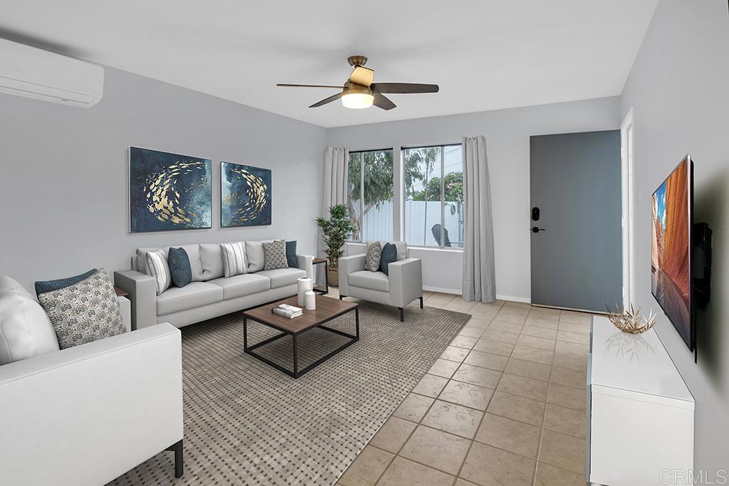 a living room with furniture and a flat screen tv