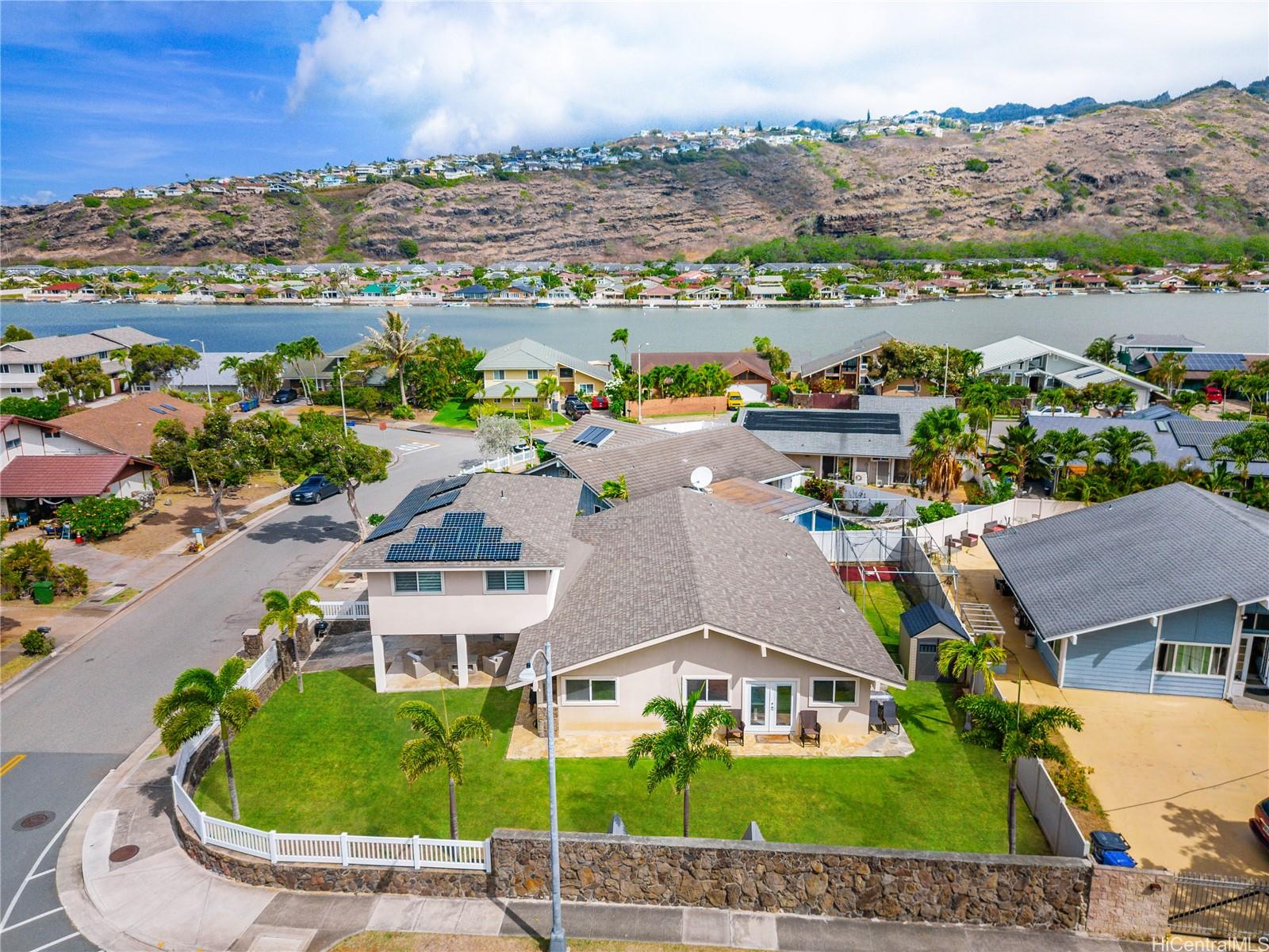 an aerial view of a house with a lake view