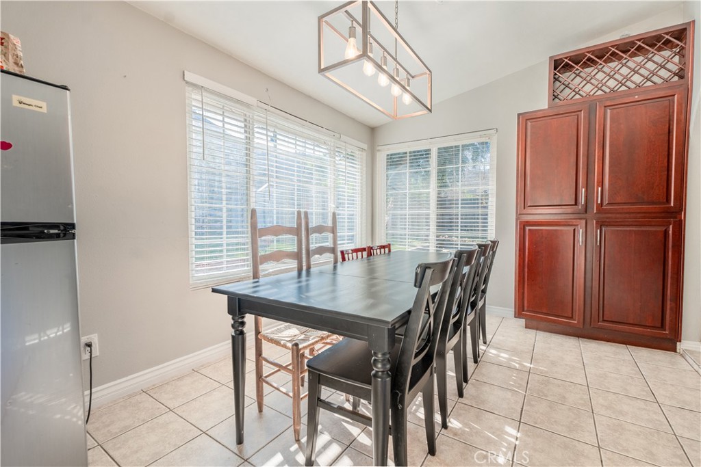 a view of a dining room with furniture and a window